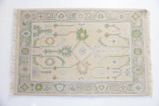 Hand-knotted wool rug with Oushak floral design in ivory, sage, and sky blue – Faye Mini Rug by Locust Lane Rugs