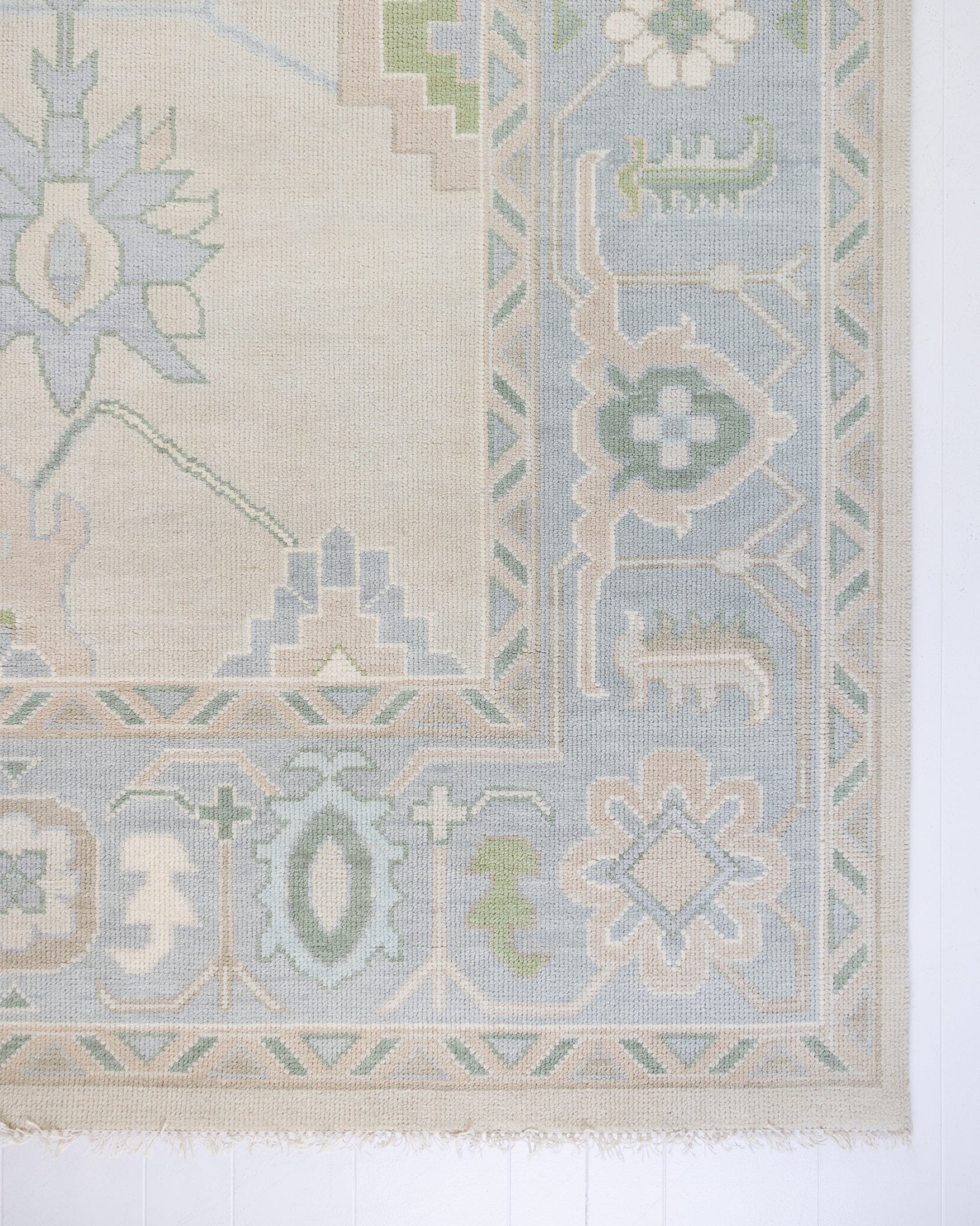 Fiona hand-knotted modern Oushak rug styled in a living room