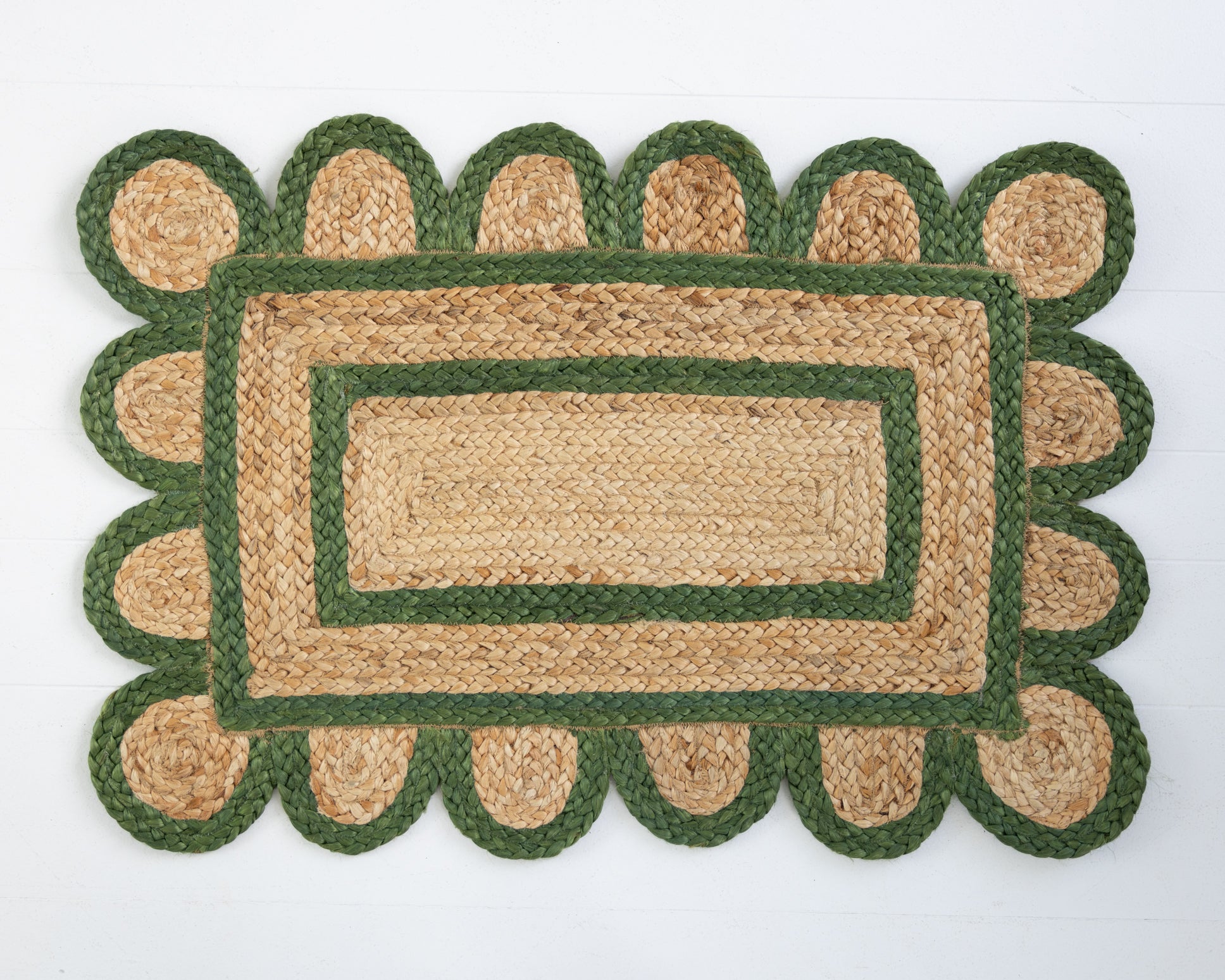 Handwoven 100% jute rug with natural field, forest green scalloped edge, and protective cotton backing – Forest Green Scalloped Edge Jute Rug by Locust Lane Rugs