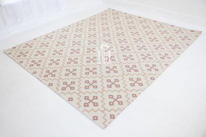 Full view of the French Rose Flatweave Rug showcasing its timeless geometric design.