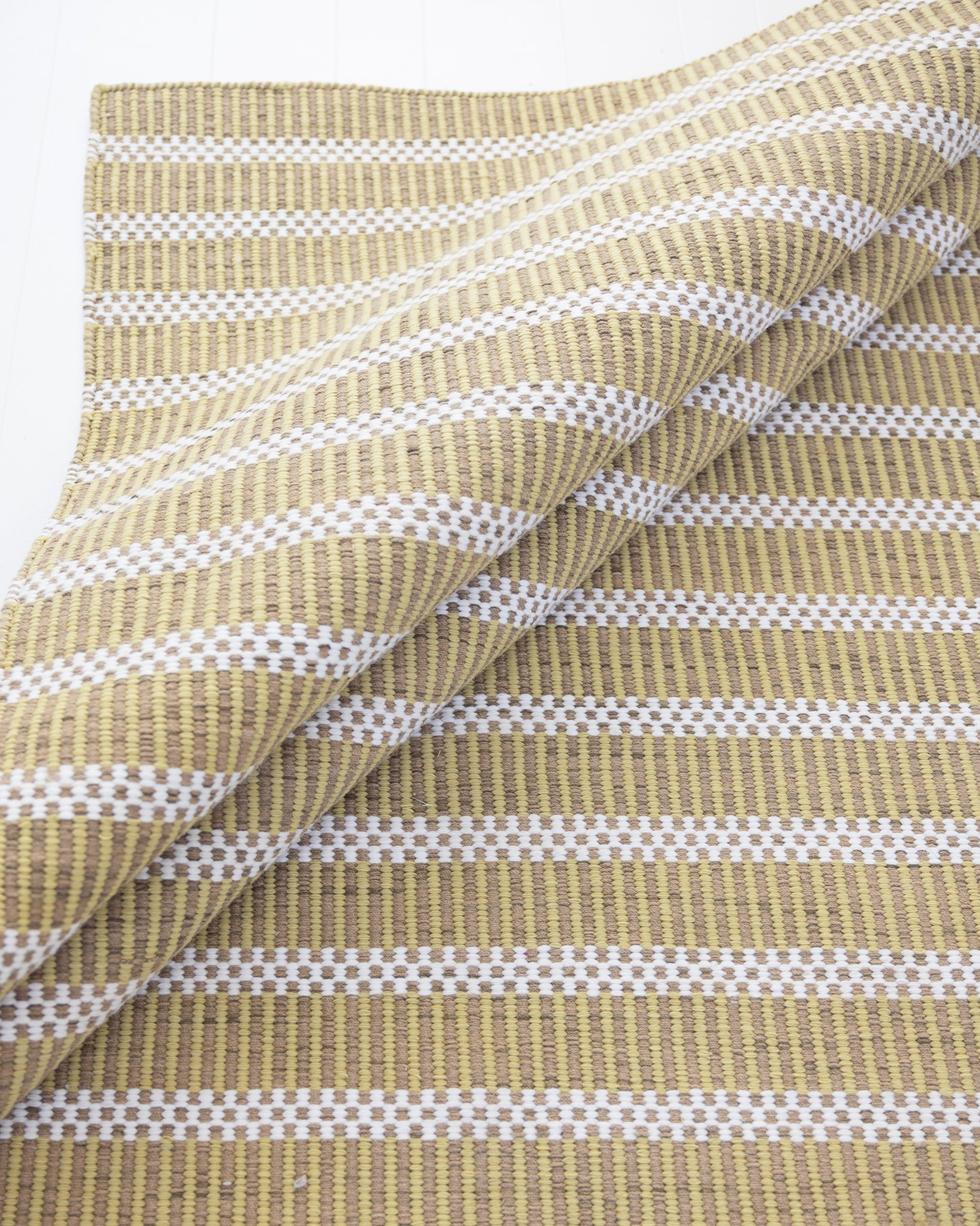 Handwoven jute and wool rug with olive green, ivory, and sand stripes – Martini Olive Jute & Wool Rug by Locust Lane Rugs