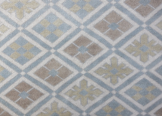 Milly hand-knotted wool Modern Oushak rug featuring a geometric diamond pattern in powder blue, sage green, taupe, and ivory.