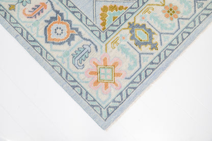 Corner detail of the Odette hand-knotted modern Oushak wool rug