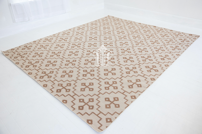 Full view of the Orchid Geometric Flatweave Rug showcasing its tonal geometric design.