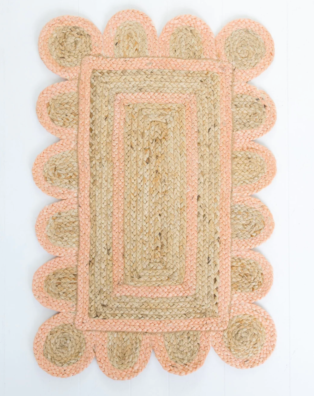 Handwoven 100% jute rug with natural field, peach scalloped edge, and protective cotton backing – Peach Scalloped Edge Jute Rug by Locust Lane Rugs