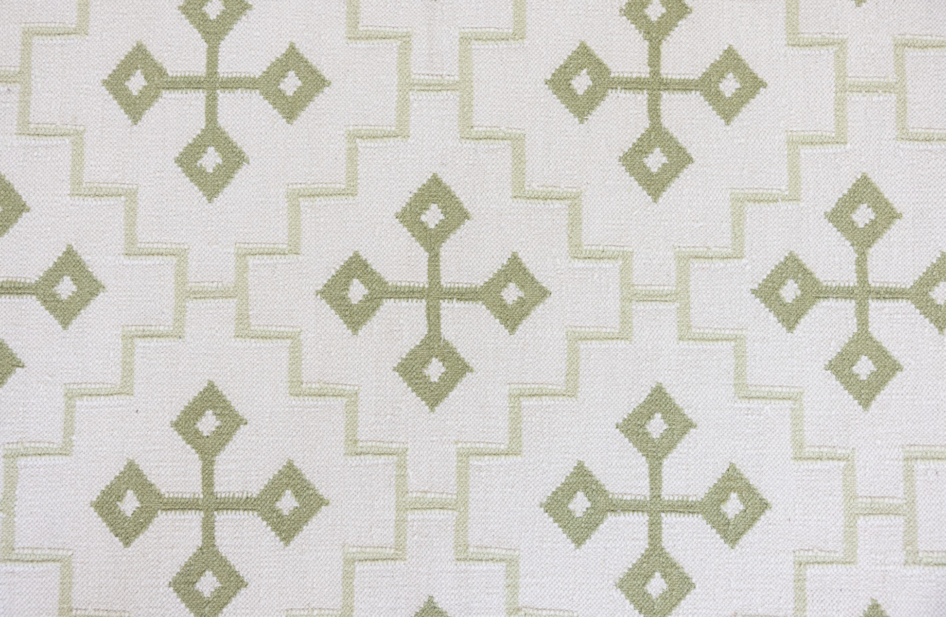 Pistachio Green Geometric Flatweave Rug with a soft green geometric pattern handwoven from 100% wool.