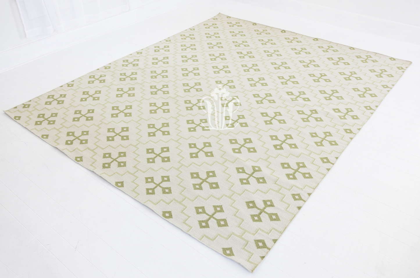 Full view of the Pistachio Green Geometric Flatweave Rug showcasing its allover geometric pattern.