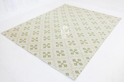 Full view of the Pistachio Green Geometric Flatweave Rug showcasing its allover geometric pattern.