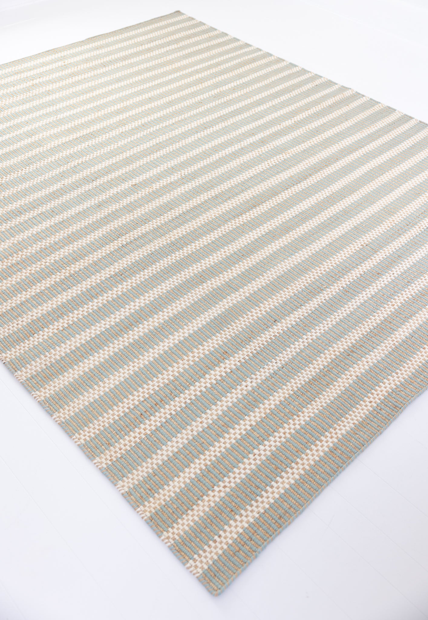 Handwoven jute and wool rug with sea blue, ivory, and natural stripes – Sea Blue Jute & Wool Rug by Locust Lane Rugs