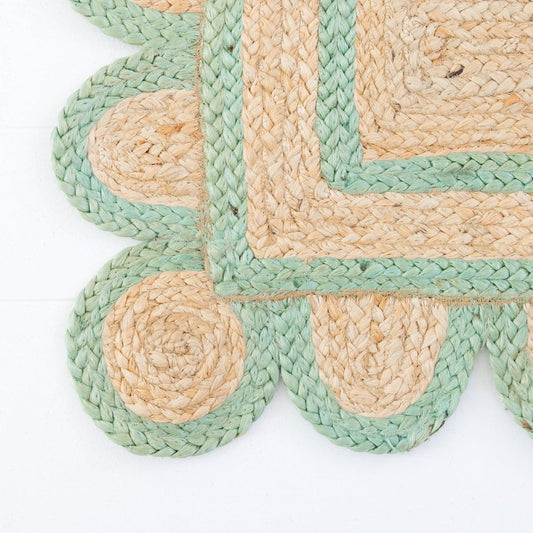 Handwoven 100% jute rug with natural field, teal green scalloped edge, and protective cotton backing – Teal Green Scalloped Edge Jute Rug by Locust Lane Rugs