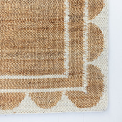 Handwoven jute and wool rug in natural tones with a crisp white scalloped border – White Scalloped Edge Rug by Locust Lane Rugs