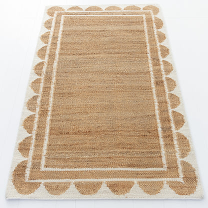 Handwoven jute and wool rug in natural tones with a crisp white scalloped border – White Scalloped Edge Rug by Locust Lane Rugs