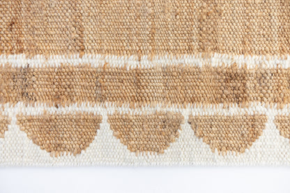 Handwoven jute and wool rug in natural tones with a crisp white scalloped border – White Scalloped Edge Rug by Locust Lane Rugs