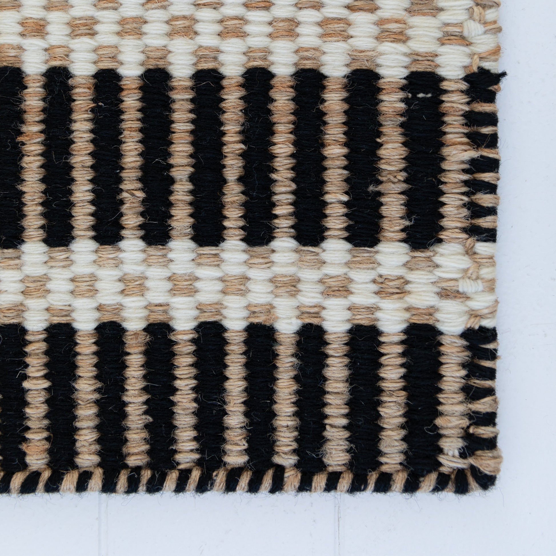 Handwoven jute and wool rug with black, ivory, and natural stripes – Black Jute & Wool Rug by Locust Lane Rugs