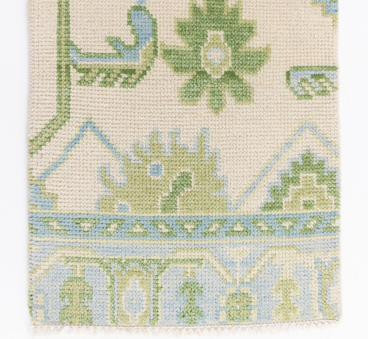 Handknotted wool rug sample in soft green, sky blue, and ivory with traditional Oushak floral motifs – Emogene Rug Sample by Locust Lane Rugs